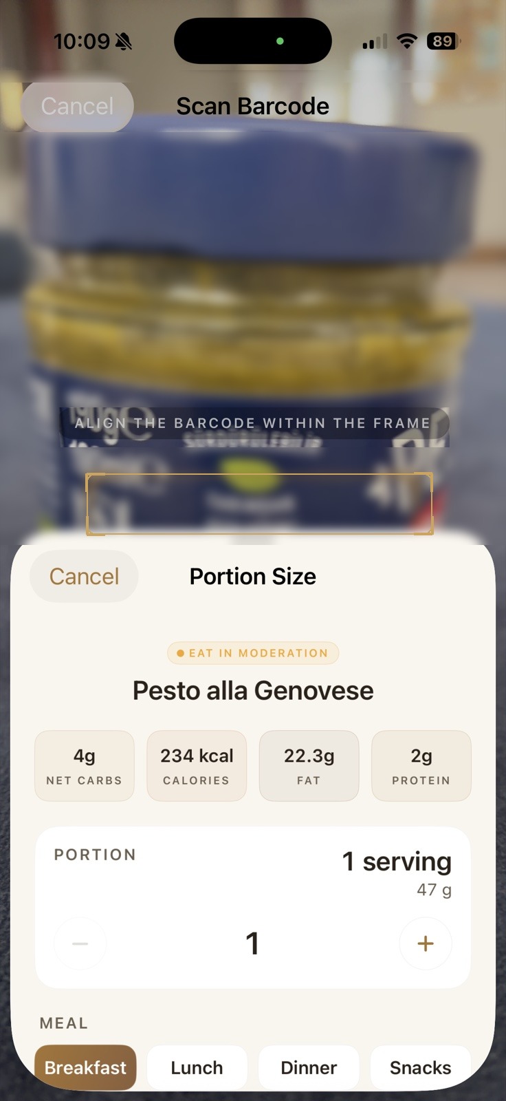 Ketoly barcode scanner identifying a jar of pesto with portion size and macros